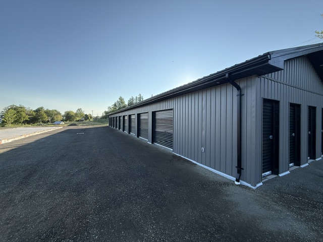 The Cove Self Storage facility under a clear blue sky